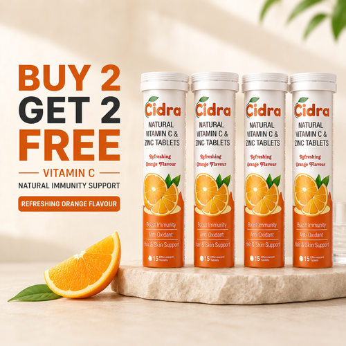 Four Cidra Vitamin C and Zinc tablets in white bottles with orange labels, displayed on a stone slab with an orange slice and leaves. Large promotional text on the left reads 'BUY 2 GET 2 FREE' and 'VITAMIN C NATURAL IMMUNITY SUPPORT'.